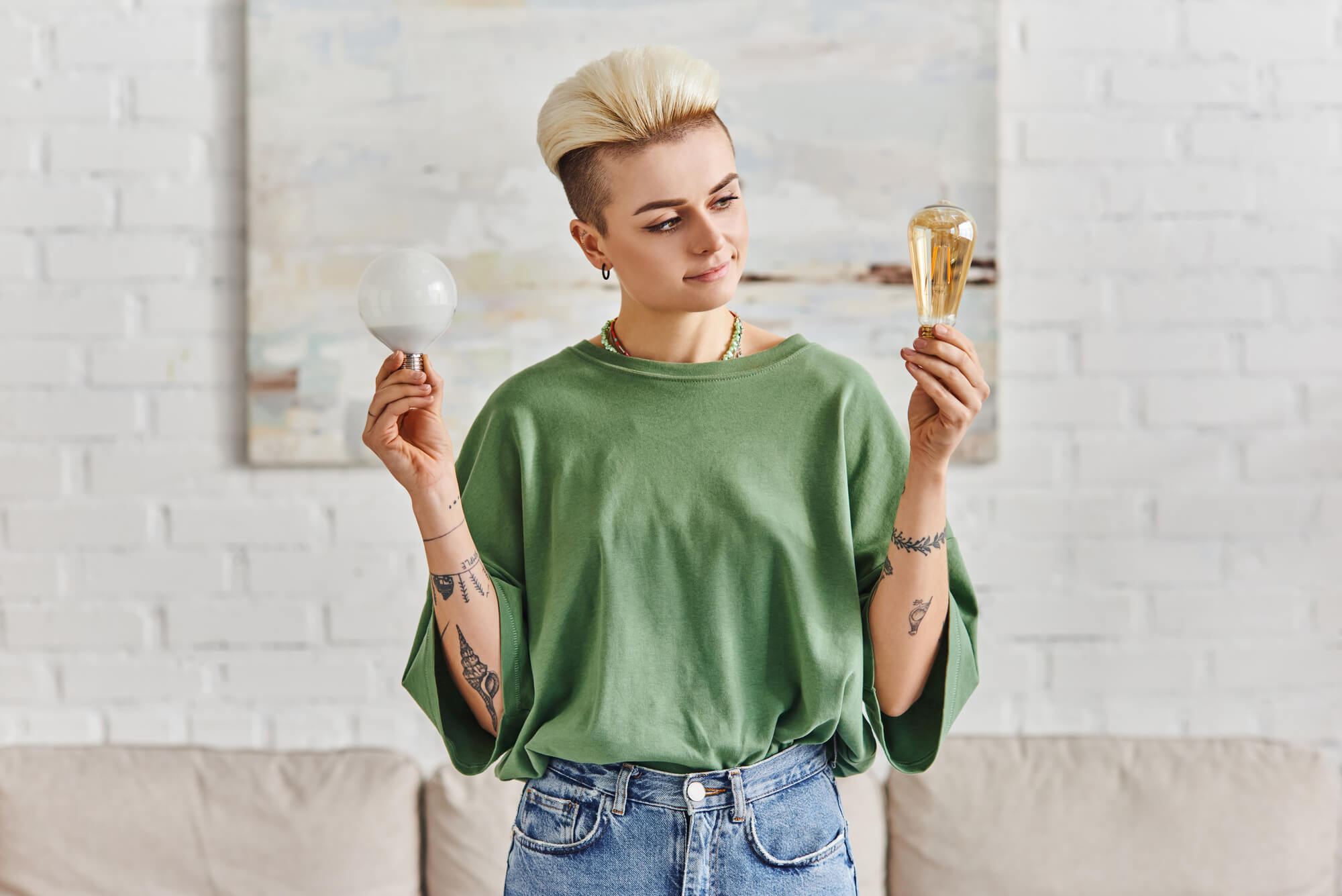 woman comparing different energy saving light bulbs in modern living room, sustainable lifestyle and environmentally conscious concept